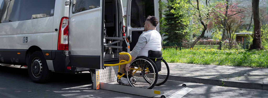 Disabled Man Being lifted into bus on the wheelchair lift.