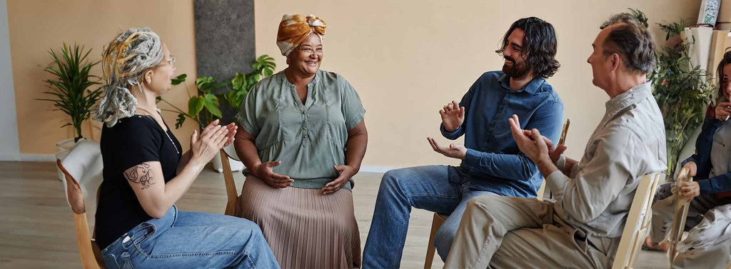 Group of elderly in counselling session receiving mental health support. 